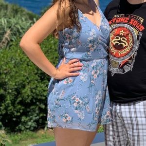 Blue Floral Romper with open back detail